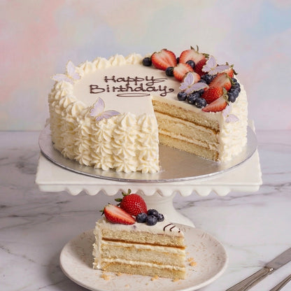 Round decorated Cream & Berry Celebration Cake with Oreo cake base from the Happy Family bakery
