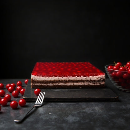  traditional cherry cake, which our bakers used to manually create delicate layers of chocolate cookies, complemented by a soft cherry jam filling and crispy chocolate pieces, covered with a shiny layer of cherry jelly